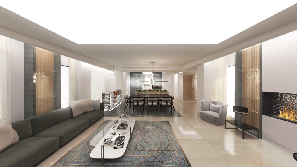 A long living room with gray sofas, a linear fireplace, wood panels and a dining area beyond.