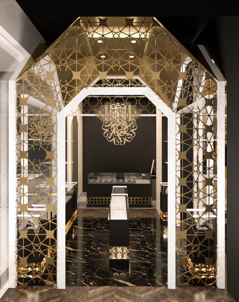 A gabled gold lattice archway framing a fitting area, with a chandelier above and a black marble floor.