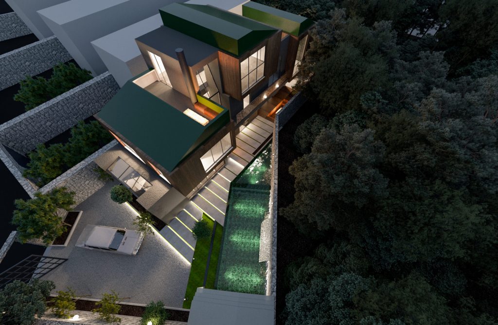 An aerial view of the villa among trees, with green roofs, a long pool and terraces stepping down the slope.