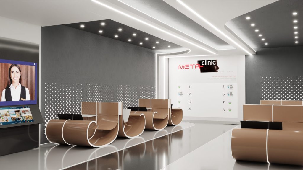 A waiting area with sculptural curved seats, a digital screen with a doctor, a white logo wall and recessed ceiling lights.