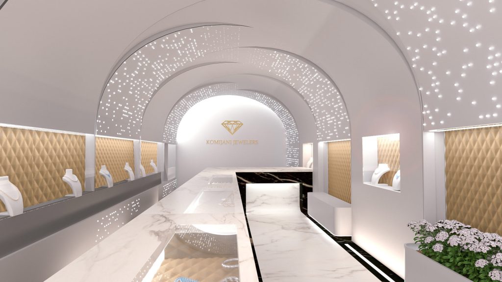 A jewelry store under white vaults pierced with tiny lights, with a long marble counter and quilted gold display niches.