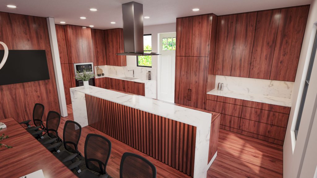 The kitchen corner with red wood cabinets, a white stone island with a fluted front, a stainless hood and the conference table.