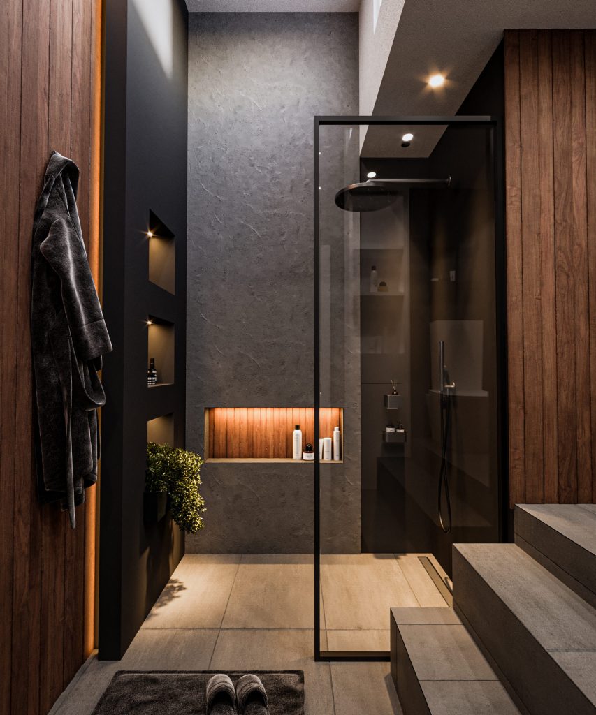 A walk-in shower behind a black-framed glass panel, with dark tiles, a warm lit niche, wood panels and a step at the entrance.
