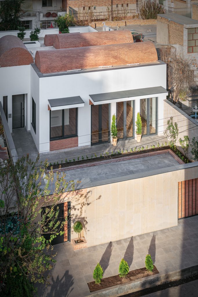 View from above into the courtyard, with brick vaults on the roof.